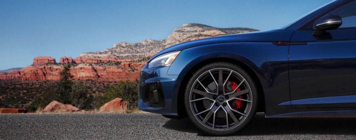 Wheel on a dark blue 2024 Audi A5 Sportback.